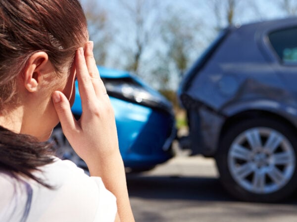 stressed woman seeing a car accident